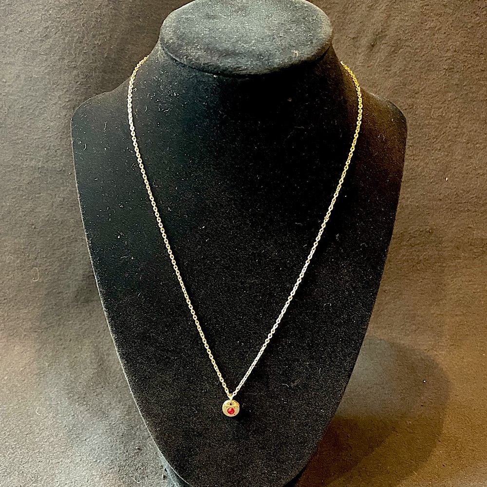 Gold-tone necklace with red stone